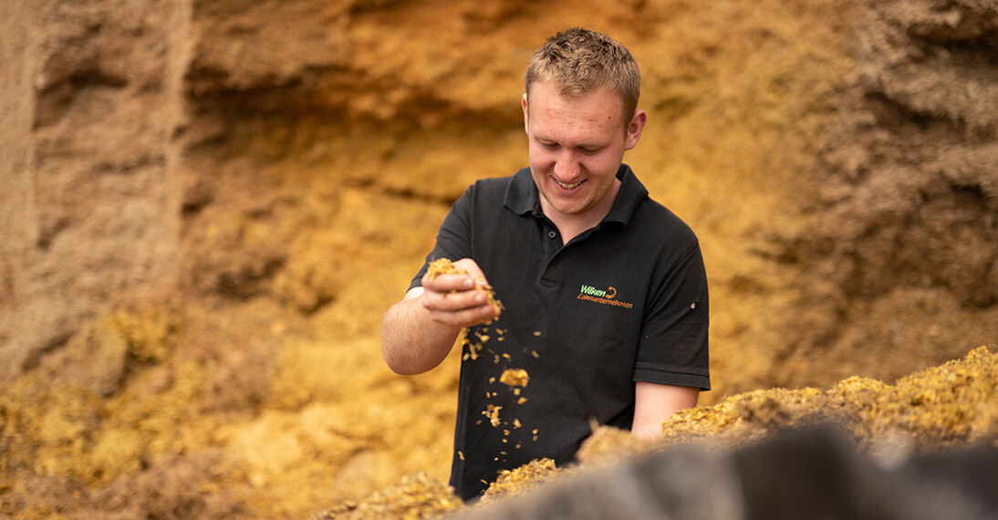 man with animal feed