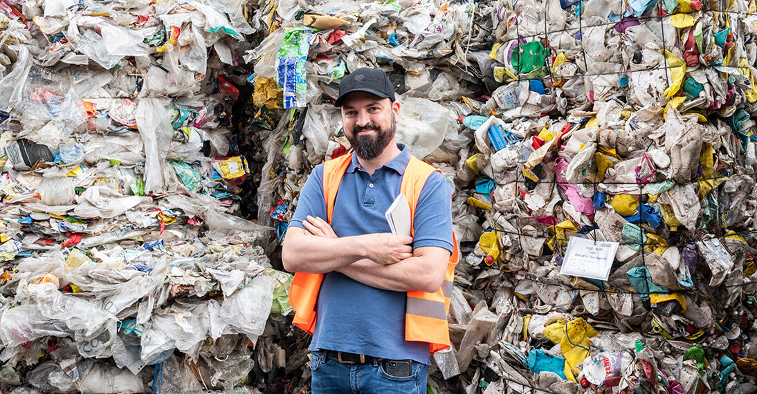 Man in front of plastic snippets